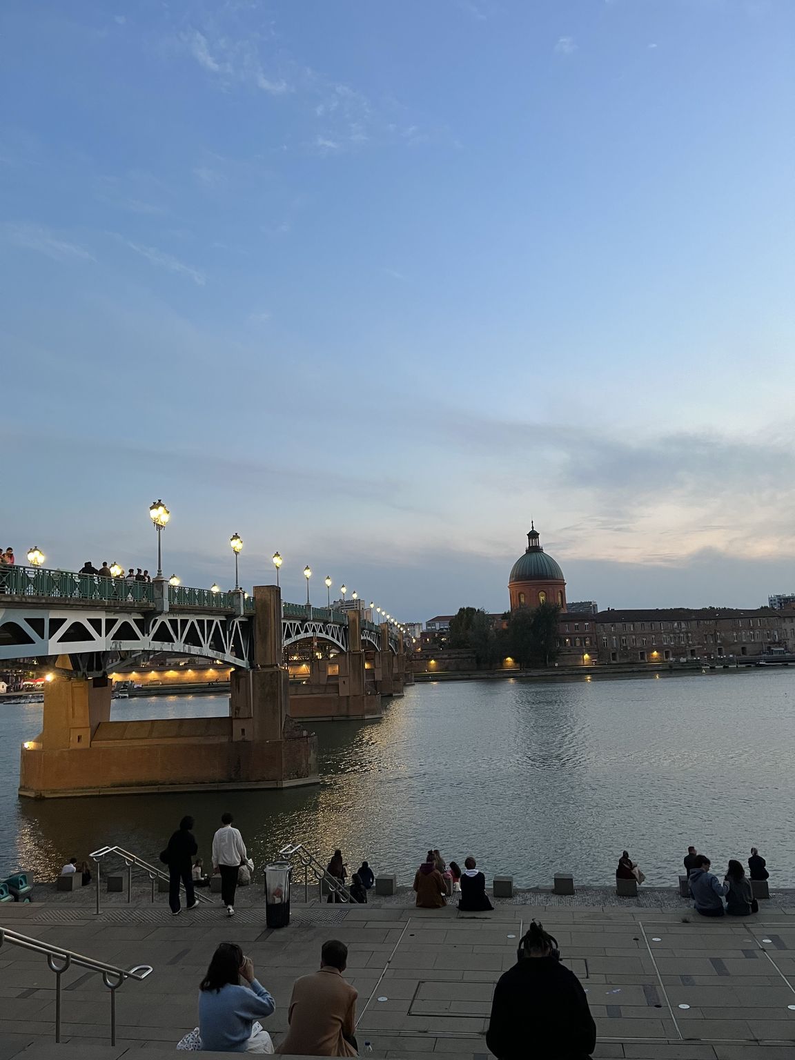 Stairs of Place Saint-Pierre and the Garonne river at sunset