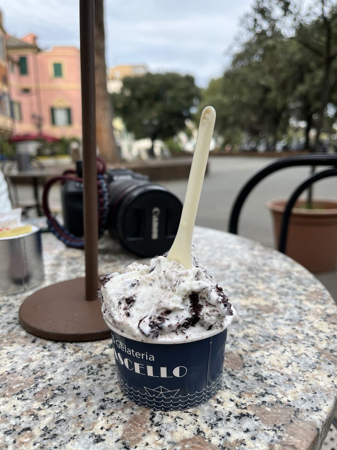 Gelato in a cup on a terrace table