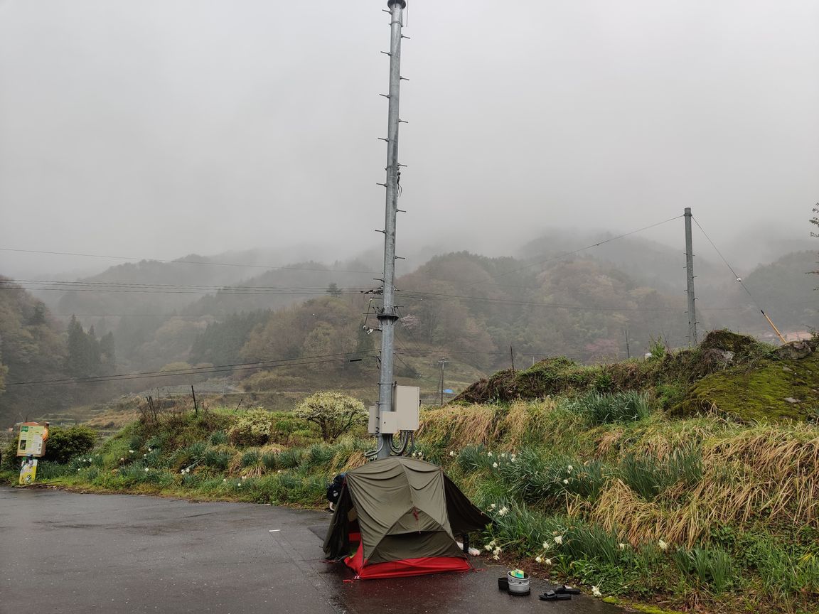 Rainy parking lot campsite in the hills somewhere in Japan